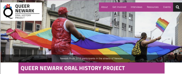 A screenshot of the homepage of Queer Newark Oral History Project. In the center, a photograph of Newark Pride 2018. Above, navigation tabs. Below, the title of the project.